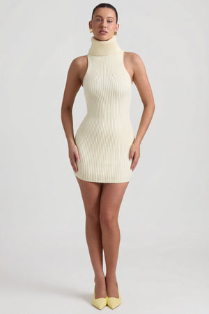 Oh Polly's Sarah wearing the Daiya Mini Dress in Butter Yellow Knitwear fabric perfect for rooftop cocktails