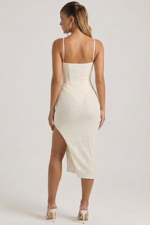 Oh Polly's Kara wearing the Eliora Midaxi Dress in White Sequin fabric perfect for a chic cocktail party