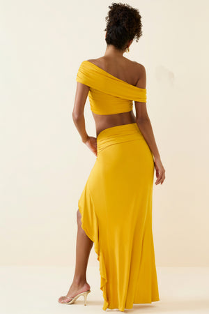 Oh Polly's Duda wearing the Imaan Maxi Skirt in Golden Yellow fabric perfect for tropical vacations