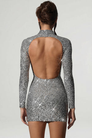 Oh Polly's Anna wearing the Kavita Mini Dress in Silver Micro Sequin fabric perfect for a night out