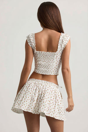 Oh Polly's Sophia wearing the Maira Mini Skirt in White Ditsy Rose Print Cotton fabric perfect for brunch with friends