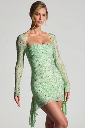 Oh Polly's Sienna wearing the Marilla Mini Dress in Pistachio Embellished fabric perfect for rooftop celebrations