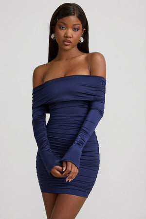 Oh Polly's Sevah wearing the Nellie Mini Dress in True Navy Satin Jersey fabric perfect for holiday celebrations