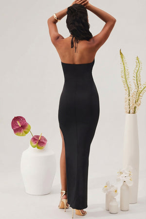 Oh Polly's Yarelis wearing the Oceane Maxi Dress in Black Slinky fabric perfect for red carpet events