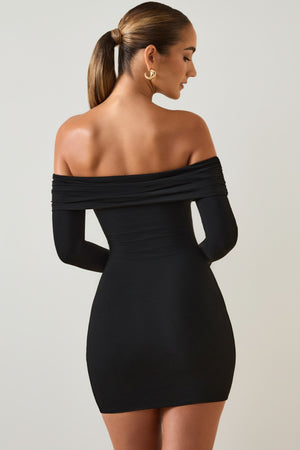 Oh Polly's Priscilla wearing the Oriana Mini Dress in Black Modal fabric perfect for cocktail parties