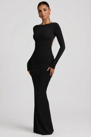 Oh Polly's Leidy wearing the Regine Maxi Dress in Black Modal fabric perfect for romantic dinner dates