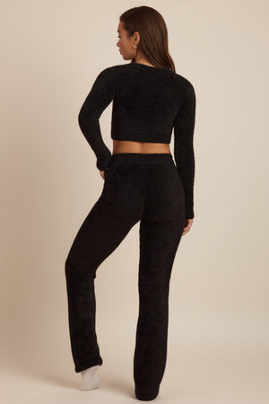 Oh Polly's Hayley wearing the Safia Trousers in Black fabric perfect for dinner dates