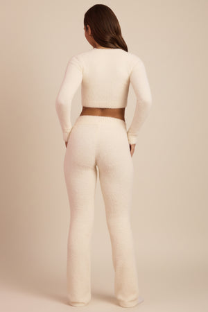 Oh Polly's Hayley wearing the Safia Trousers in Ivory fabric perfect for summer date night