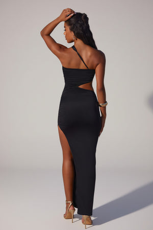 Oh Polly's Yarelis wearing the Suvi Maxi Dress in Black Slinky fabric perfect for chic city nights