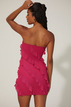 Oh Polly's Yarelis wearing the Tatiana Mini Dress in Fuchsia Mesh fabric perfect for cocktail evenings