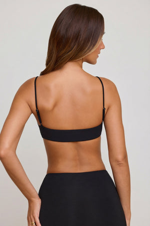 Oh Polly's Priscilla wearing the Veda Bralette in Black Modal fabric perfect for rooftop drinks