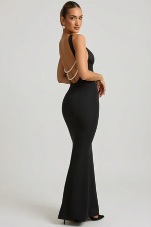 Oh Polly's Priscilla wearing the Xanthia Maxi Dress in Black Satin fabric perfect for black tie galas