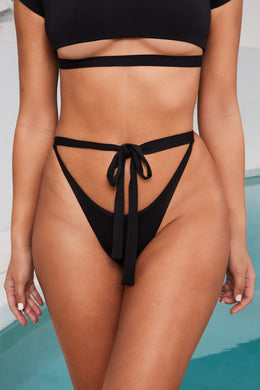 Braguitas de bikini tipo tanga con cintura anudada en negro de Spill The Tea