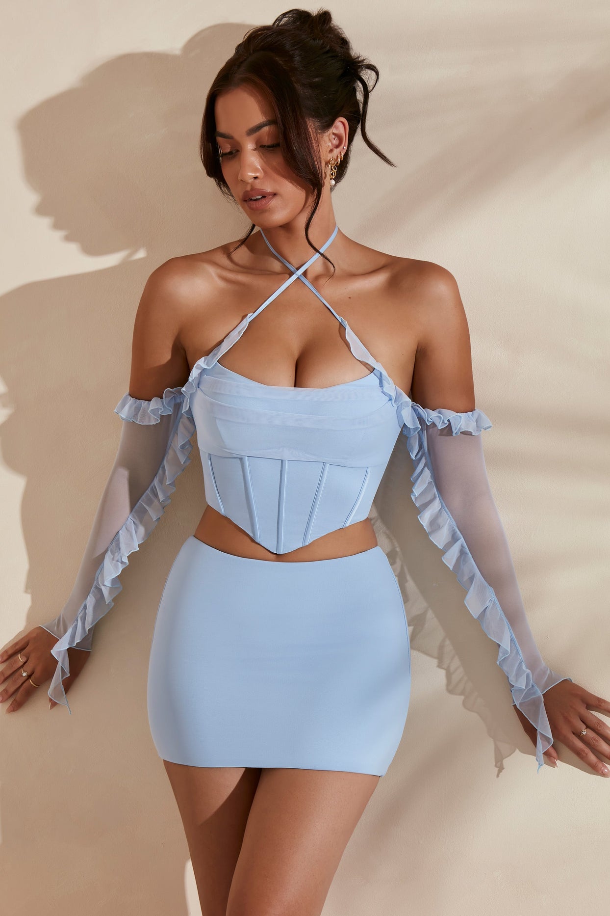 Full view of crop top in light blue with matching bodycon skirt