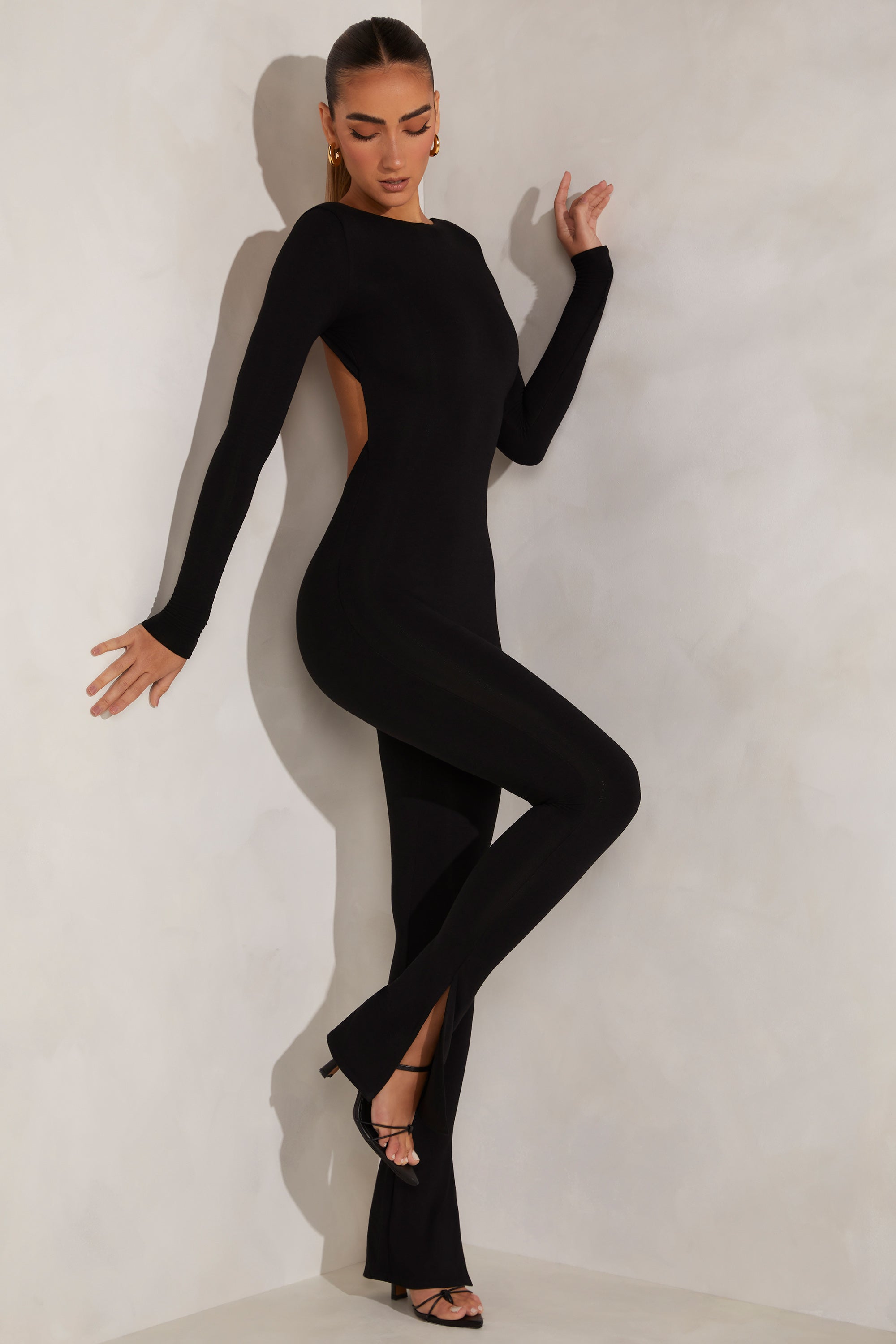 Rumer High Neck Open Back Jumpsuit in Black | Oh Polly