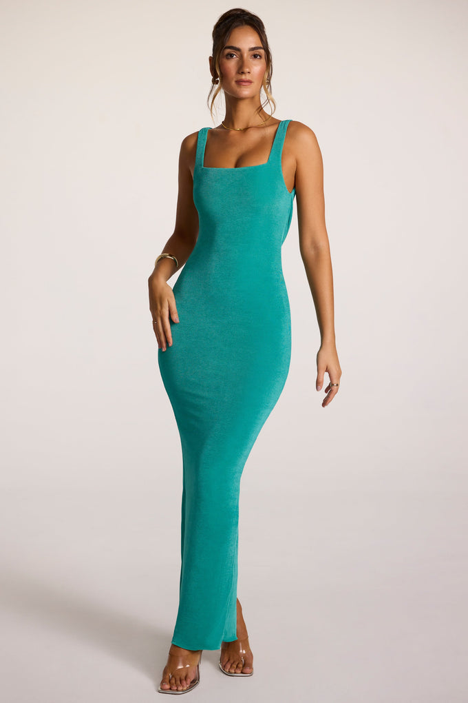 Vestido largo de punto texturizado con cuello cuadrado y espalda descubierta en color verde azulado
