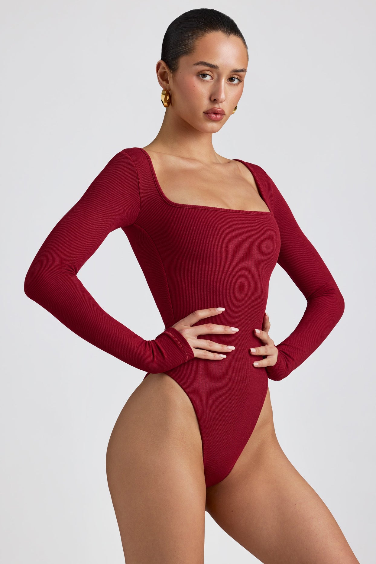 Women Express red, long sleeve body suit. Size large. Prev