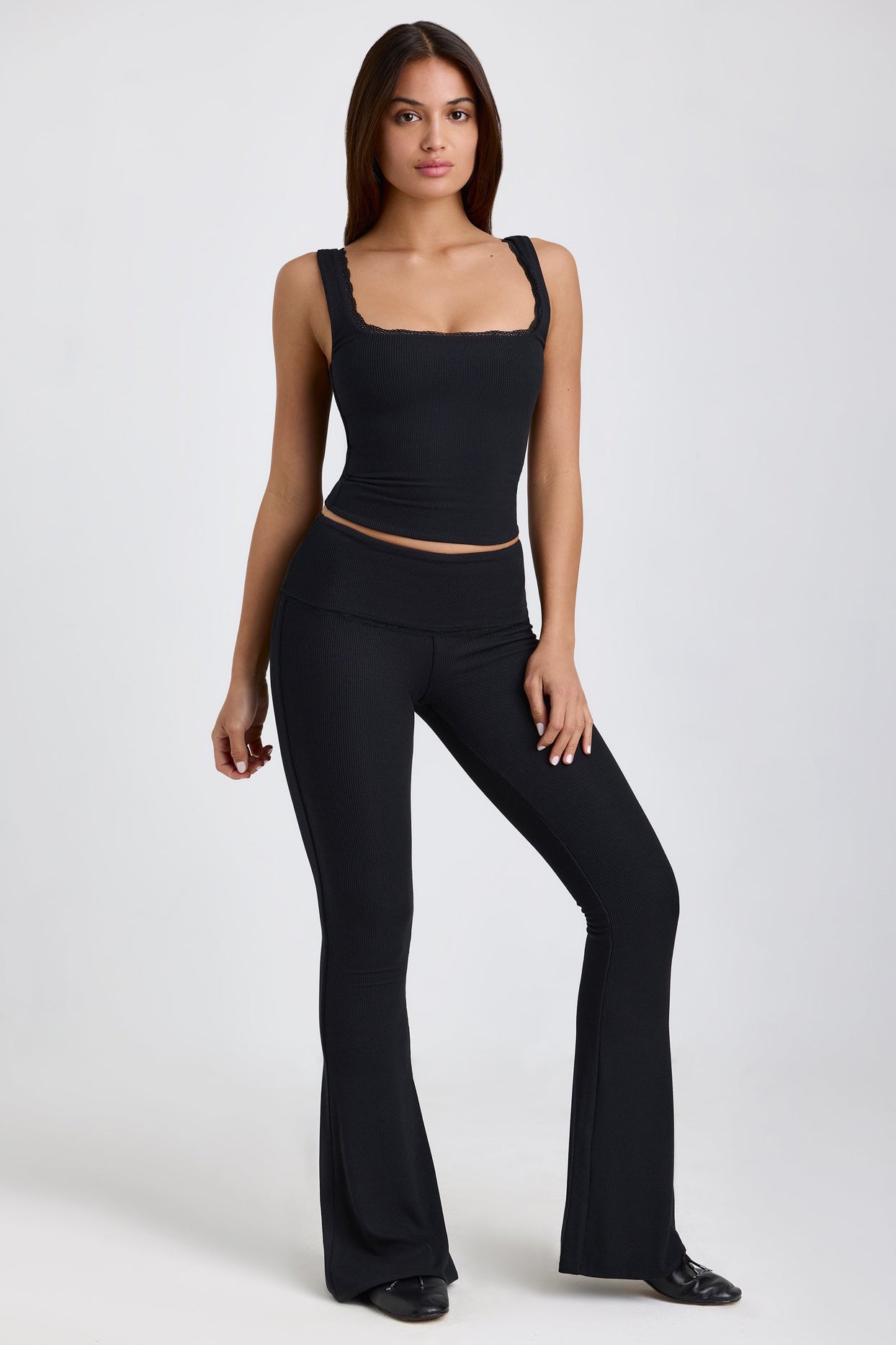 Jules Ribbed Modal Mid-Rise Foldover Flared Trousers in Black | Oh Polly