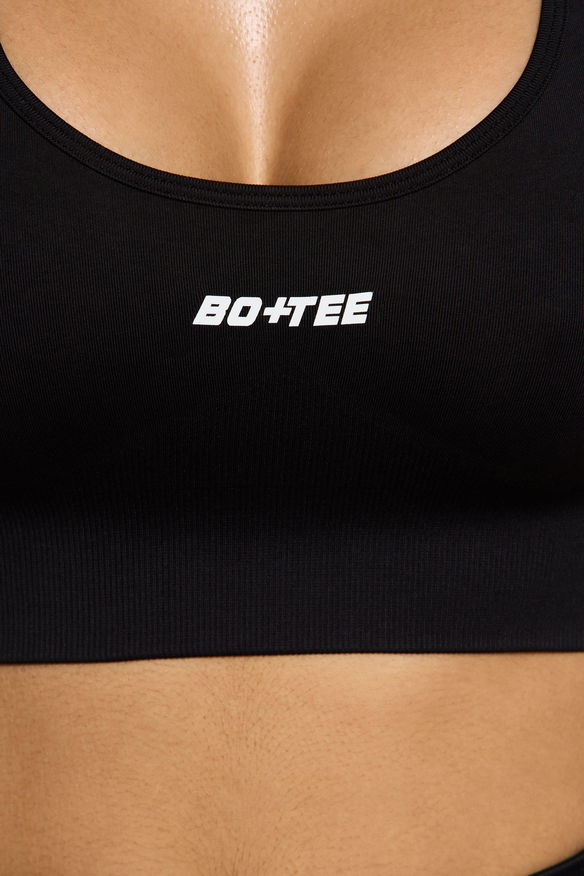 Focused Halter Neck Supportive Sports Bra in Black Oh Polly