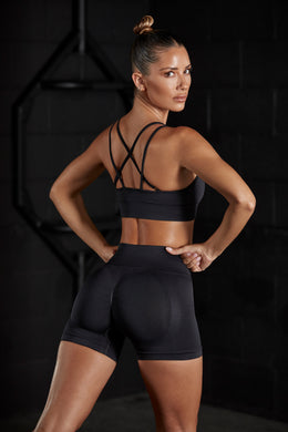 Side view of Seamless High Waist Mini Shorts in Black