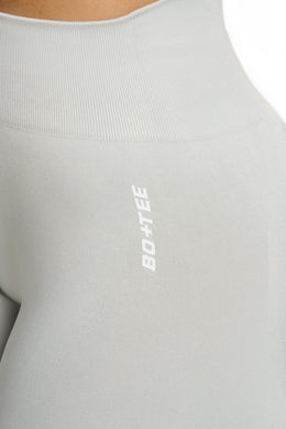 Close up of grey high waisted sports leggings