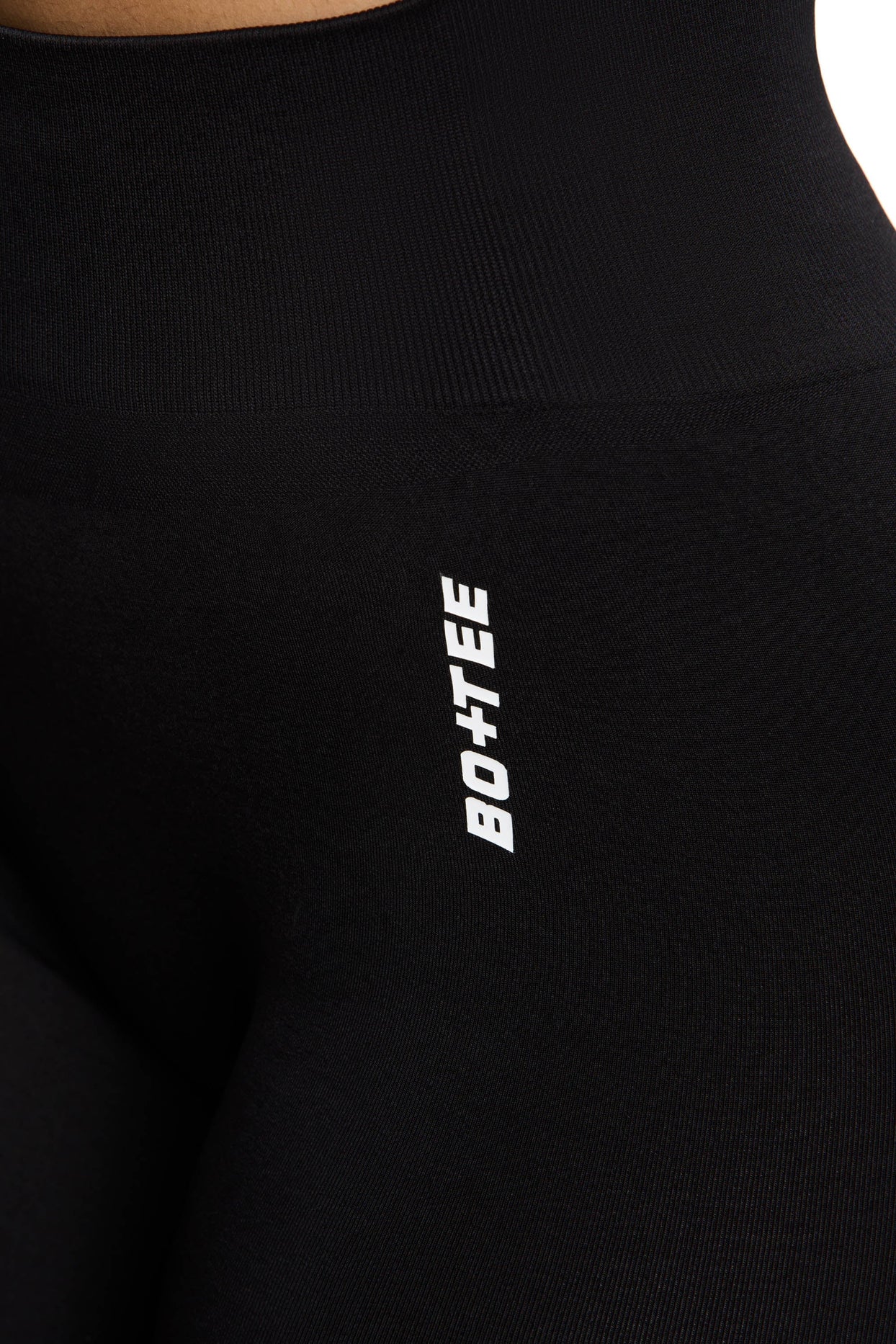 Close up  view of high waisted sports leggings in black