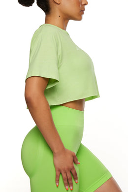Side View of Cropped raw hem T-shirt in Green