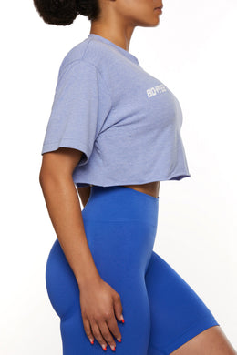 Side View of Cropped raw hem T-shirt in Dark Blue
